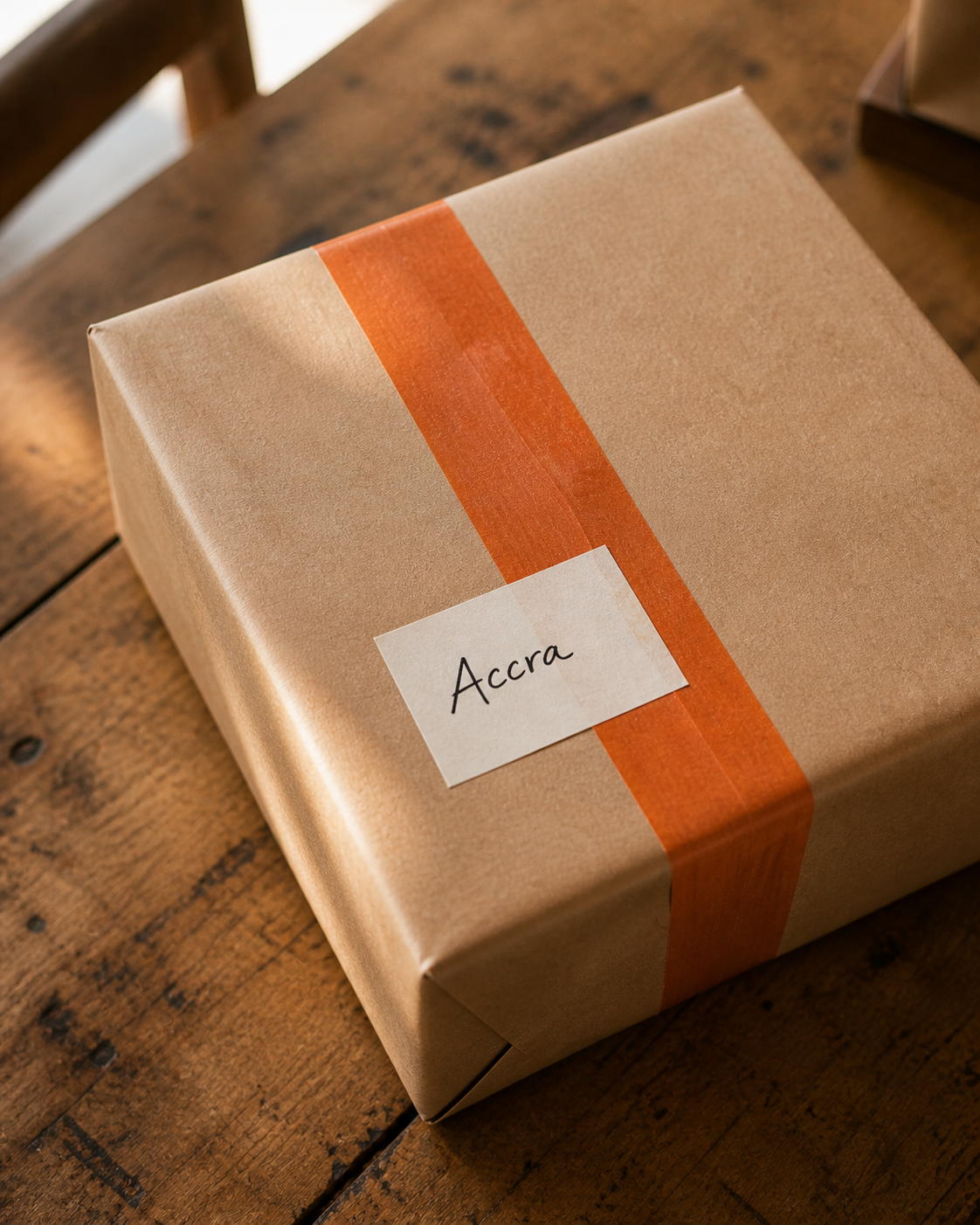 A neatly packaged parcel on a wooden surface